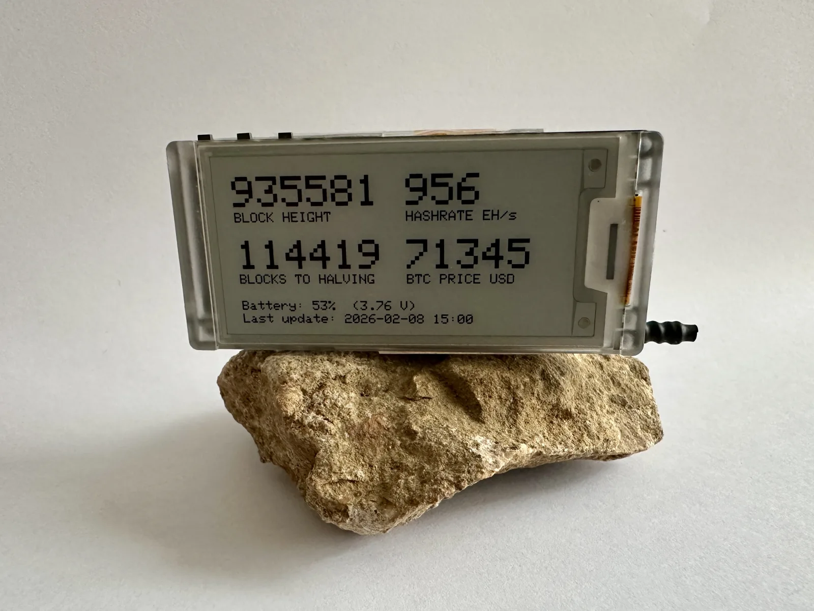 DIY block clock on a desk showing Bitcoin block data on an e-ink display