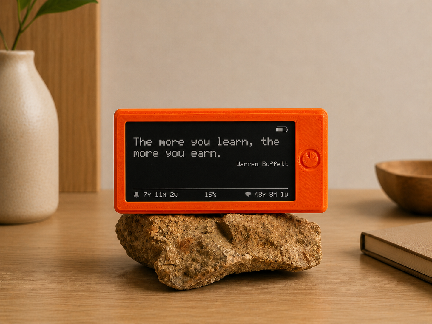 The Freedom Clock showing a motivational quote on its e-ink screen